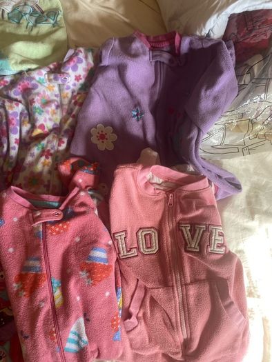 10 all in ones, 3 baby sleep bag, 4 pink blankets