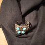 silver tone butterfly cuff bracelet featuring faux turquoise stones and intricate wire work. Image 6