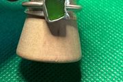 Handmade sterling silver spinner ring with green sea glass. Size M