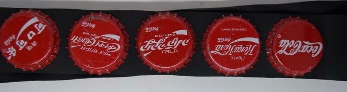 Coca Cola belt with cola caps from all over the world