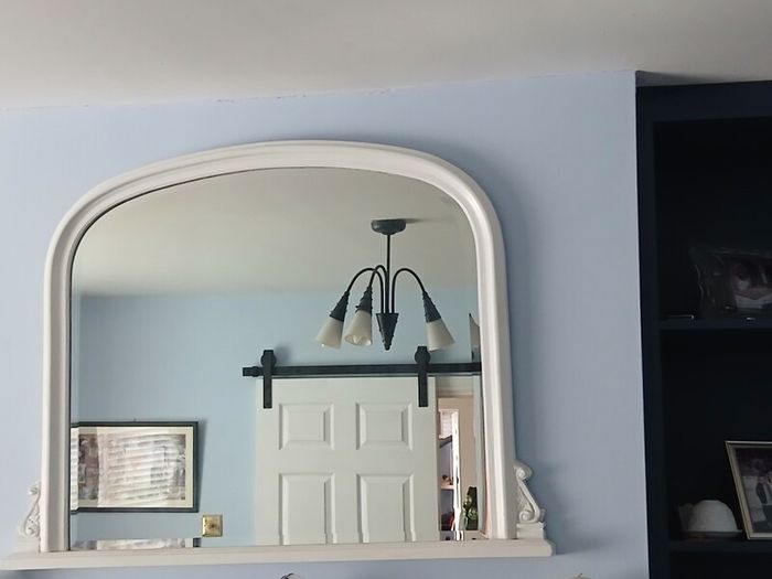 white over mantlepiece mirror