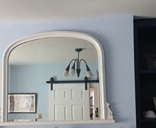white over mantlepiece mirror