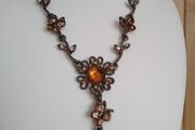Victorian revival aesthetic  dark antiqued metal with warm amber tones