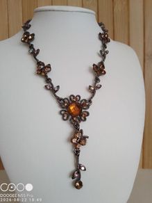 Victorian revival aesthetic  dark antiqued metal with warm amber tones