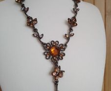 Victorian revival aesthetic  dark antiqued metal with warm amber tones