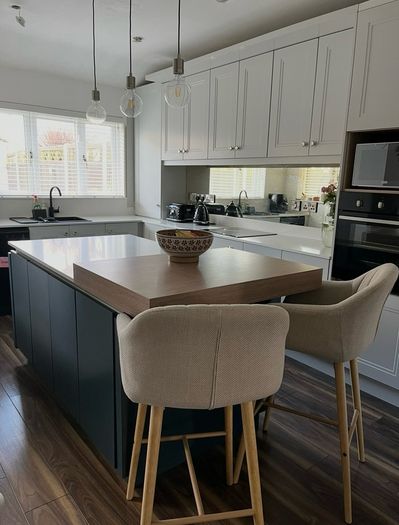 4 beige dining chairs and 2 counter stools