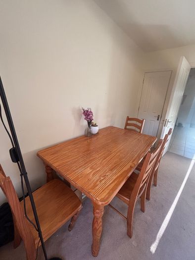 Wooden dining table with chairs