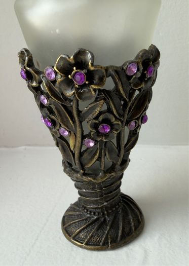 Vintage-style frosted glass perfume bottle.