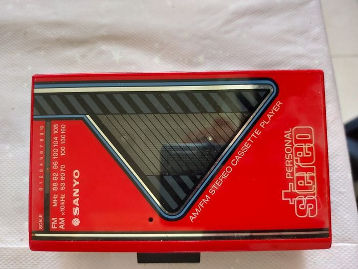 Sony Walkman and Sanyo AM-FM Stereo cassette Player, excellent cosmetic condition, no cables or batteries