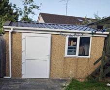 Deluxe 14ft x 12ft Modular Concrete Building Shed with brindle pebble dash finish.