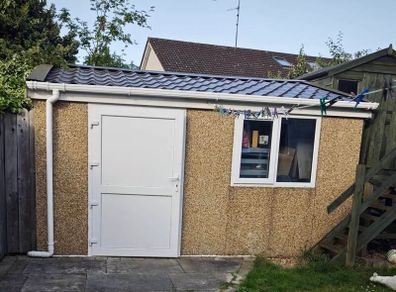 Deluxe 14ft x 12ft Modular Concrete Building Shed with brindle pebble dash finish.