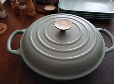 cast, enamelled shallow casserole dish.