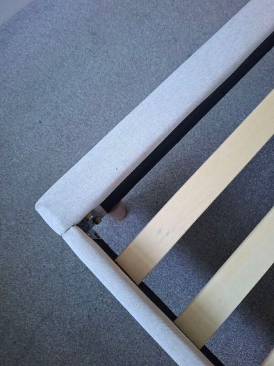 Standard double bed with cream headboard