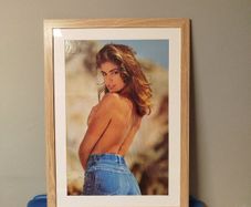 A framed vintage Cindy Crawford poster
