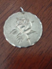 Sterling silver charm.