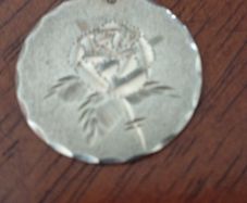 Sterling silver charm.