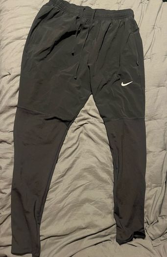 Nike Dri-FIT UV Challenger Men s Woven Hybrid Running Pants Nike Bottoms running pants size large