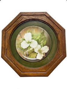 Vintage porcelain plate oak frame behind glass