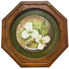 Vintage porcelain plate oak frame behind glass
