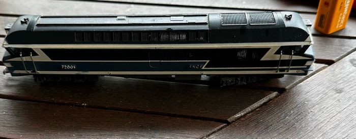 This engine is a vintage Jouef OO scale (1/87) SNCF CC 72001 diesel model locomotive featuring the classic French railway blue and white livery.