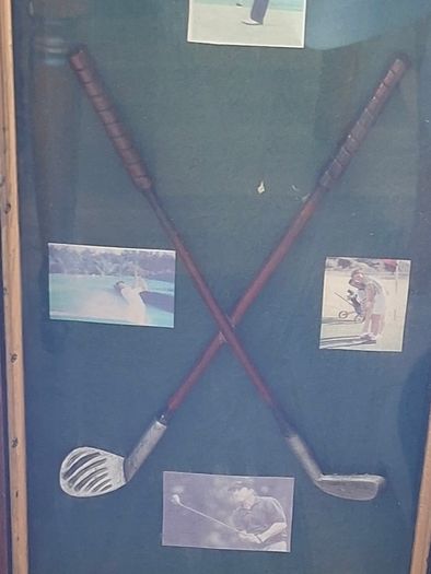 Beautiful Wooden Golf-Themed Shadow Box and Storage Unit with Shelves Cabinet, featuring a glass door front Inside the glass display panel, it showcases a vintage-style collage celebrating the history of golf,