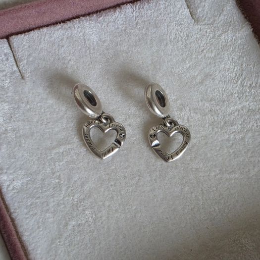 Pandora linked sister hearts split dangle charm. Very good condition hallmarked