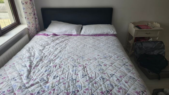 Double beds and kitchen seats