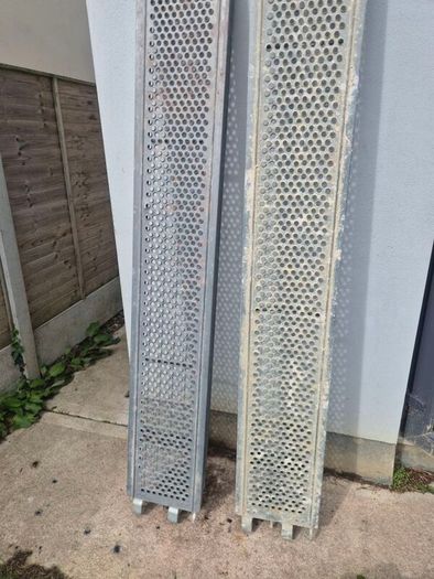Two galvanised steel scaffolding planks