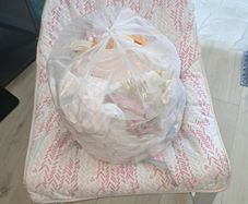 baby rocking chair and clothes bundle
