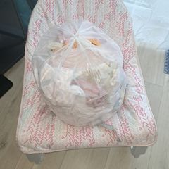 baby rocking chair and clothes bundle