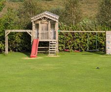 Playhouse and swings