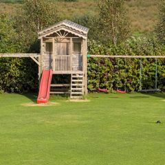 Playhouse and swings