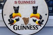 Guinness  twin toucan cast iron sign