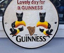 Guinness  twin toucan cast iron sign