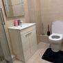 Room with double bed and attached washroom Image 9