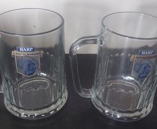 2 x harp tankard glasses ,buyer collects or pays postage thank you,,sold as is ,collectors items,,