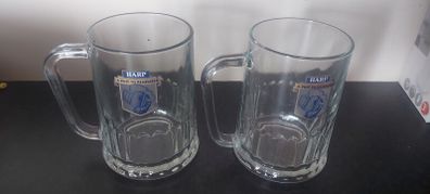 2 x harp tankard glasses ,buyer collects or pays postage thank you,,sold as is ,collectors items,,