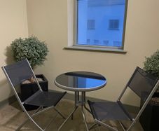 Two folding chairs and a table