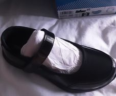 Girls black patent sketchers shoes
