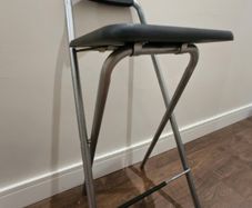 Foldable high stool used as a ladder