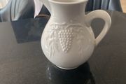 Vintage ceramic pitcher with embossed decoration