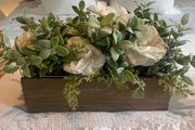 Faux flower arrangement in wooden box