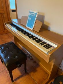 Yamaha piano and stool