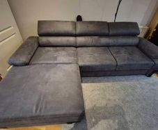 dark grey corner sofa with sleeping and storage