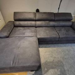 dark grey corner sofa with sleeping and storage