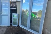 Grey UPVC French doors, single door and window