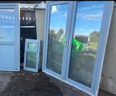 Grey UPVC French doors, single door and window
