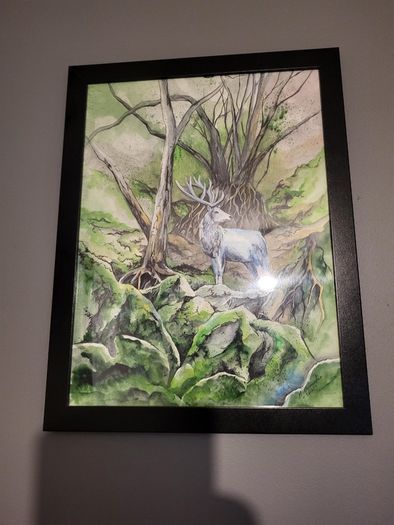 Watercolor painting with black frame. forest deer