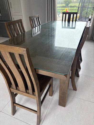 Dining table with glass top and 8 dining chairs