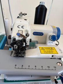 Blind hemming machine